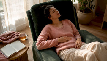 Woman resting on sofa during menstruation fatigue