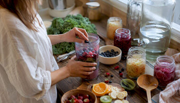 Hands preparing fermented foods in kitchen