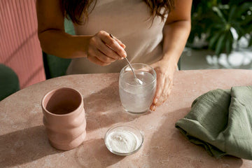 Woman preparing a daily myo inositol drink