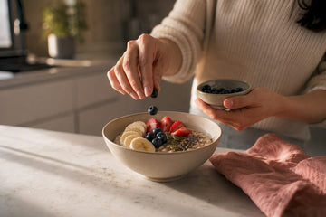 Hands assembling a balanced breakfast bowl