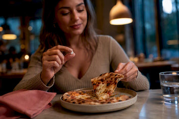 Hand taking lactase before eating pizza