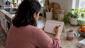Woman planning cycle timing on calendar