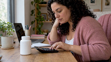 Woman calculating probiotic monthly cost
