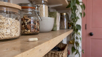 Probiotic capsule on a pantry shelf