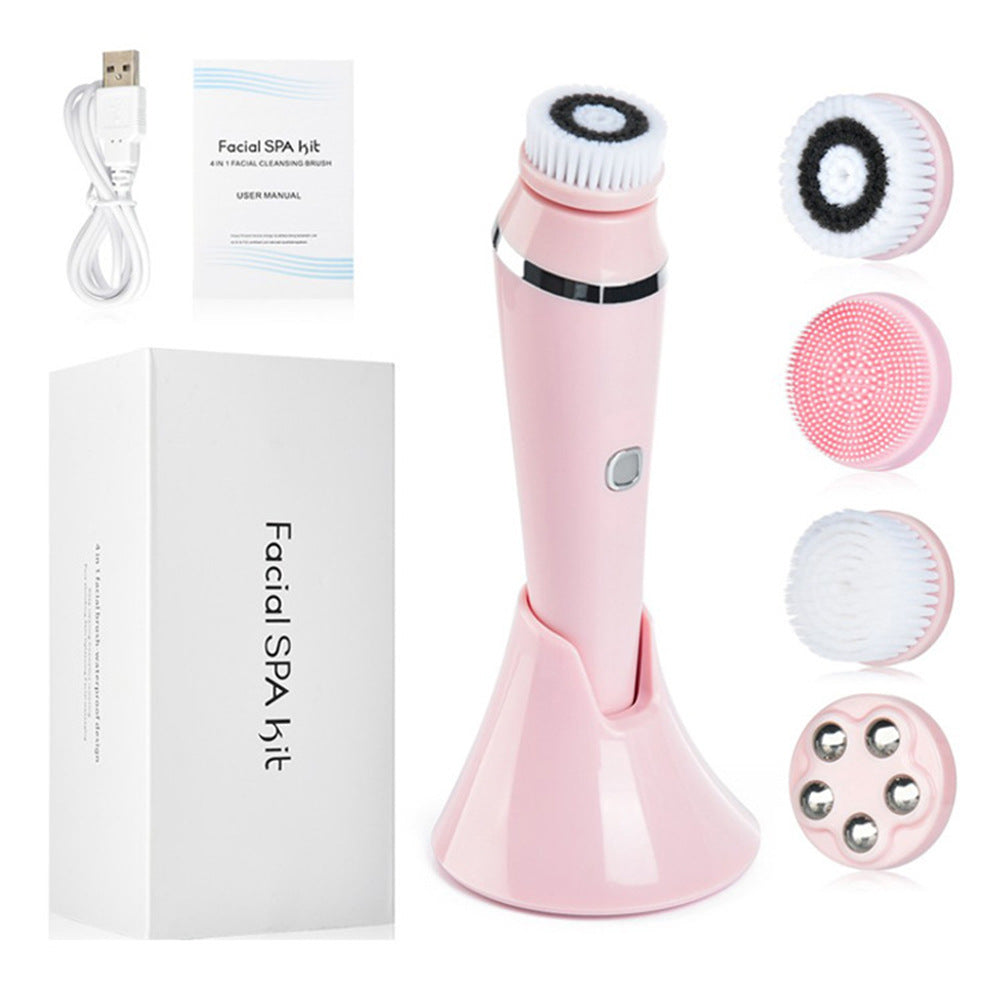 Pink facial cleansing device with attachments and packaging on a white background