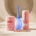 Florva Total Balance and Glow Kit: three intimate care products, a probiotic capsule tub, a pH balanced wash and an intimate rinse, on a beige background
