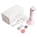 Pink electronic device with attachments and packaging on a white background