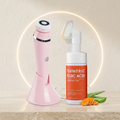 Pink skincare device and Turmeric Kojic Acid cleansing foam bottle on a neutral background